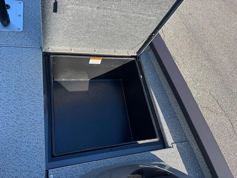 Slide: The Image of Open storage compartment on 2025 G3 Sportsman 1710 boat deck. - 16