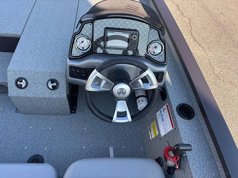 Slide: The Image of 2025 G3 Sportsman 1710 boat dashboard with steering wheel and gauges. - 19