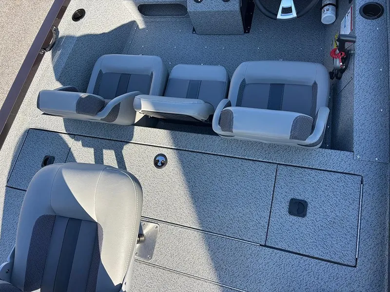Slide: The Image of 2025 G3 Sportsman 1710 boat interior with gray seating and storage compartments. - 20