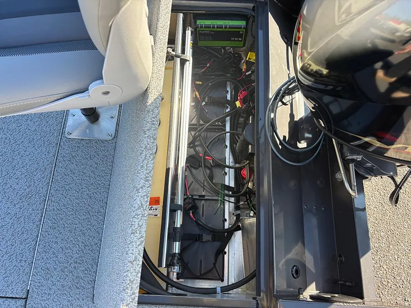 Slide: The Image of 2025 G3 Sportsman 1710 boat interior showing wiring and battery compartment. - 23