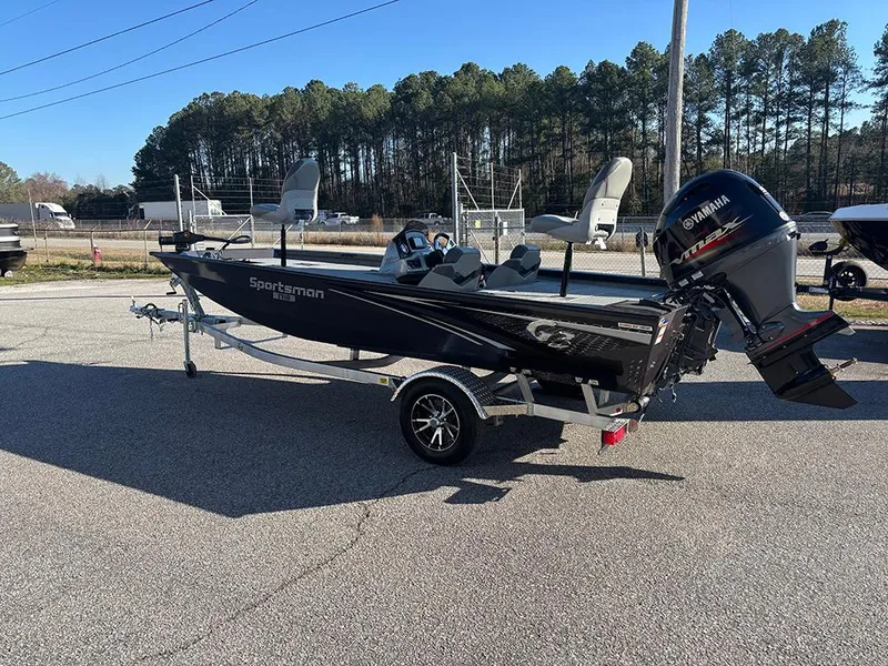Slide: The Image of 2025 G3 Sportsman 1710 boat with Yamaha motor on a trailer, parked outdoors. - 3