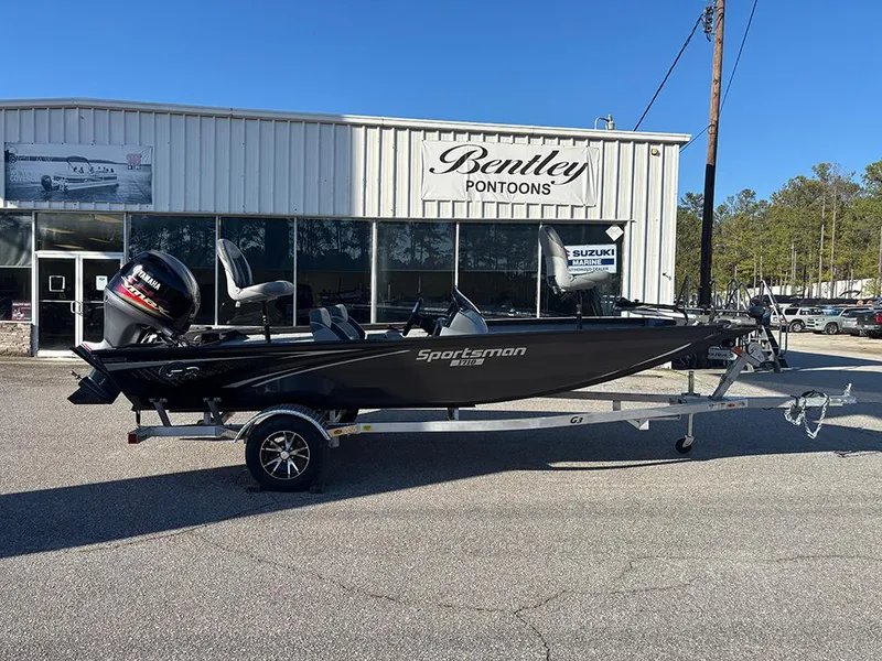 Slide: The Image of 2025 G3 Sportsman 1710 boat on trailer outside Bentley Pontoons dealership. - 6