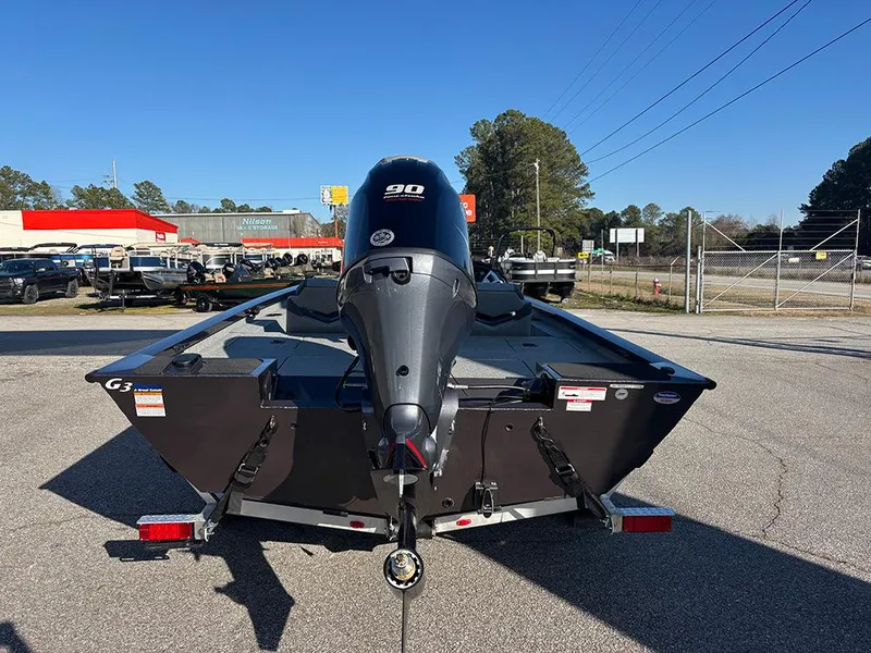 Slide: The Image of 2025 G3 Sportsman 1710 boat with 90 HP engine, parked outdoors. - 8