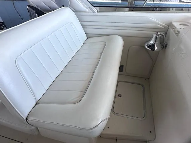 Slide: The Image of White leather seating on 1996 Sea Ray 400 EXPRESS boat interior. - 10