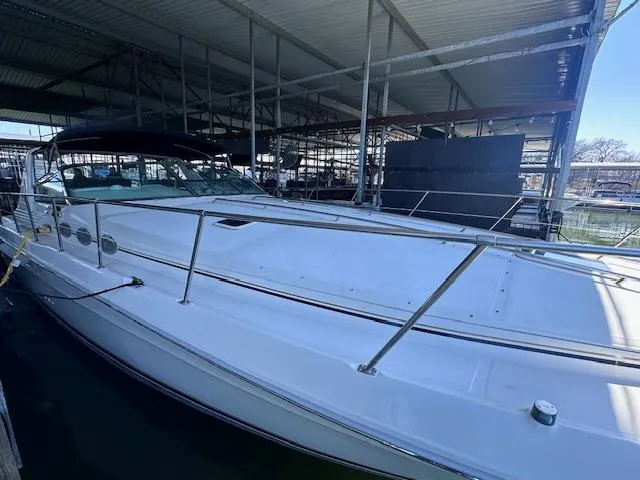 Slide: The Image of 1996 Sea Ray 400 EXPRESS yacht docked in a covered marina. - 2