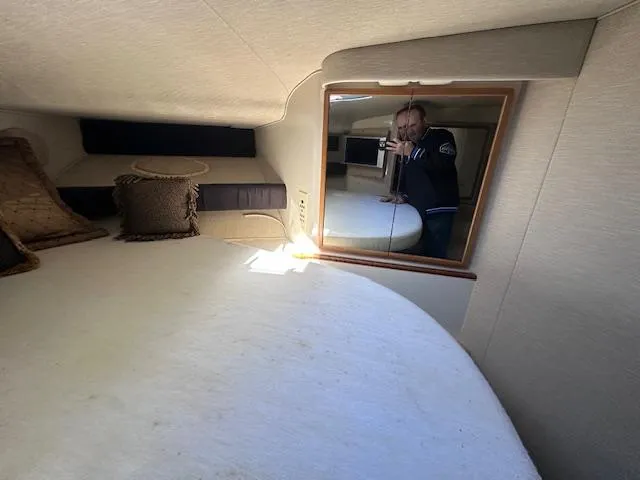 Slide: The Image of Interior cabin of 1996 Sea Ray 400 EXPRESS yacht with bed and mirror. - 22