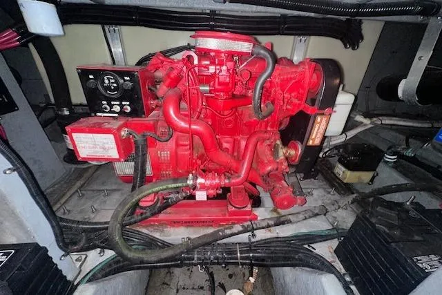 Slide: The Image of Engine compartment of a 1996 Sea Ray 400 Express Cruiser with a red engine. - 26