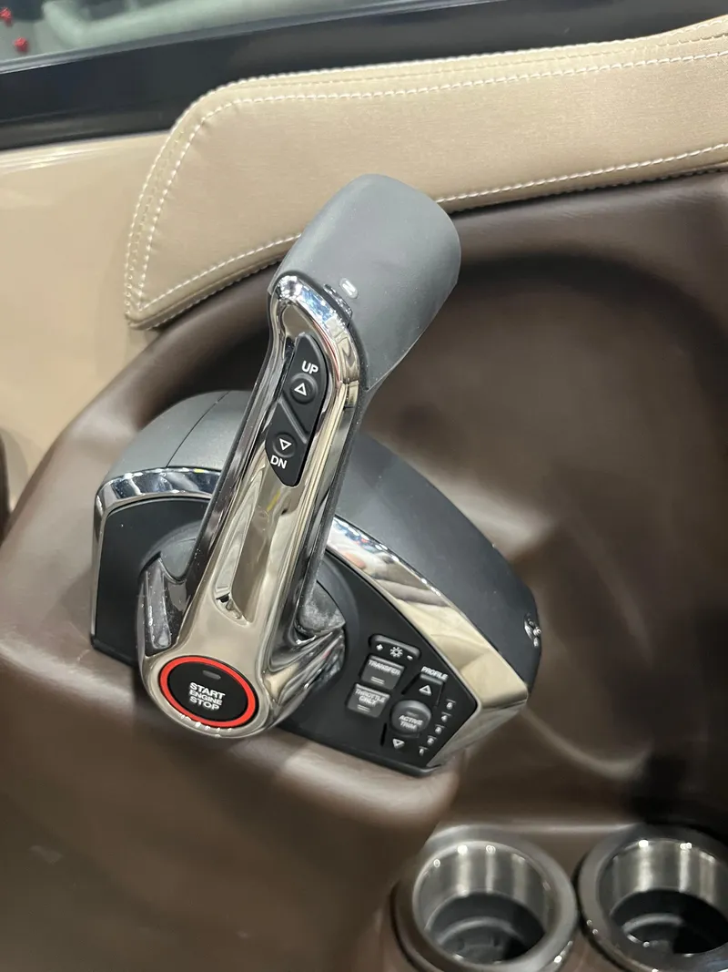Slide: The Image of 2025 Bennington Q Line throttle control with Smart Mode button and cup holders. - 8