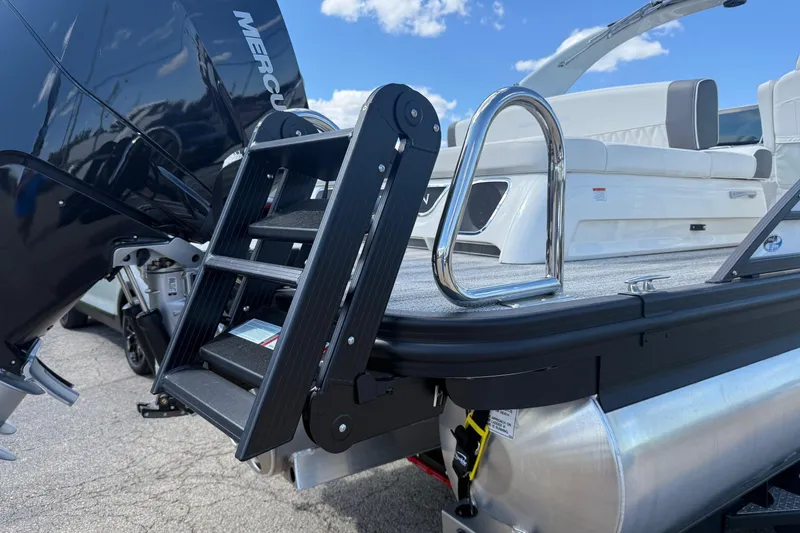 Slide: The Image of 2025 Bennington R Line boat with Mercury engine and boarding ladder. - 10
