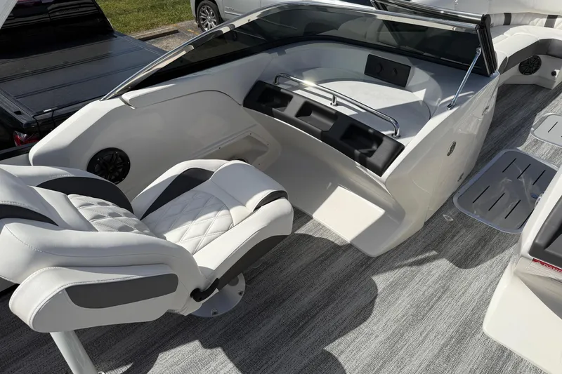 Slide: The Image of 2025 Bennington R Line boat interior with luxurious seating and modern design. - 11