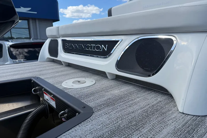 Slide: The Image of 2025 Bennington R Line boat interior with sleek design and integrated speakers. - 16