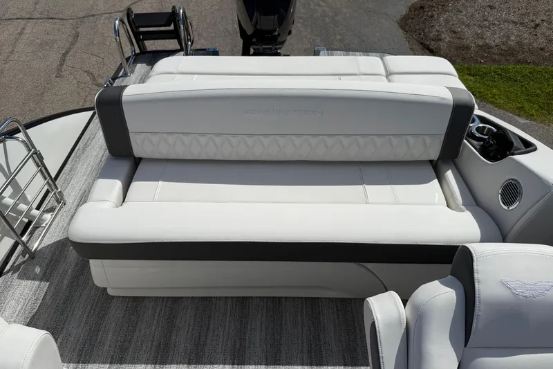 Slide: The Image of 2025 Bennington R Line boat interior with luxurious white seating and modern design. - 18