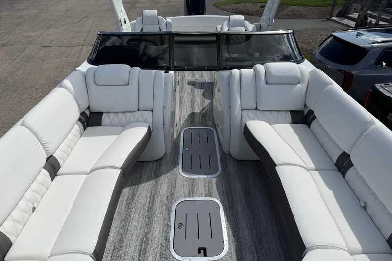 Slide: The Image of 2025 Bennington R Line boat interior with luxurious white seating and modern design. - 2