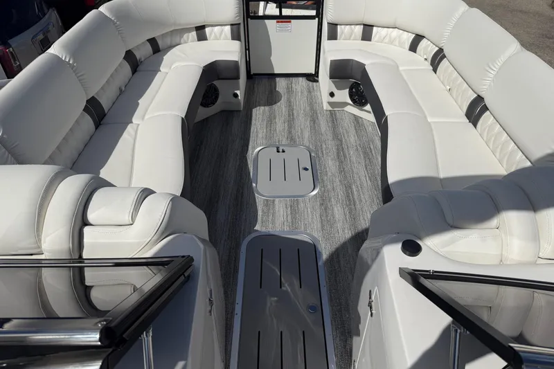 Slide: The Image of Luxurious interior of 2025 Bennington R Line boat with plush white seating. - 4