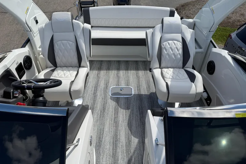 Slide: The Image of 2025 Bennington R Line boat interior with luxurious seating and modern design. - 5