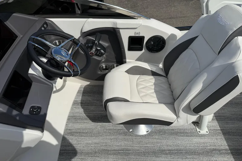 Slide: The Image of Luxury interior of 2025 Bennington R Line boat with steering wheel and plush seating. - 8