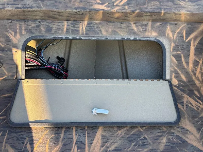 Slide: The Image of Open storage compartment in 2025 G3 Gator Tough 16 FL boat. - 13