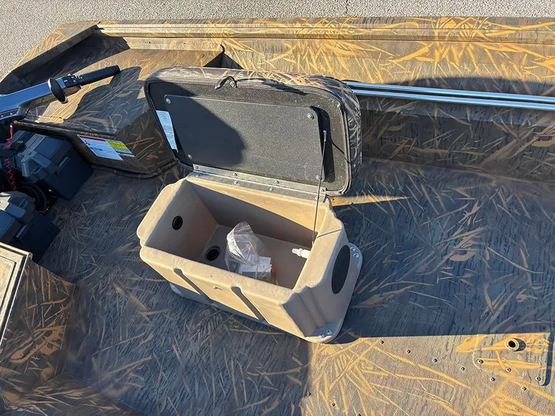 Slide: The Image of 2025 G3 Gator Tough 16 FL boat interior with open storage compartment. - 14