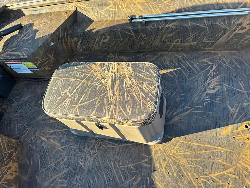 Slide: The Image of 2025 G3 Gator Tough 16 FL boat interior with camouflage pattern and storage compartment. - 15