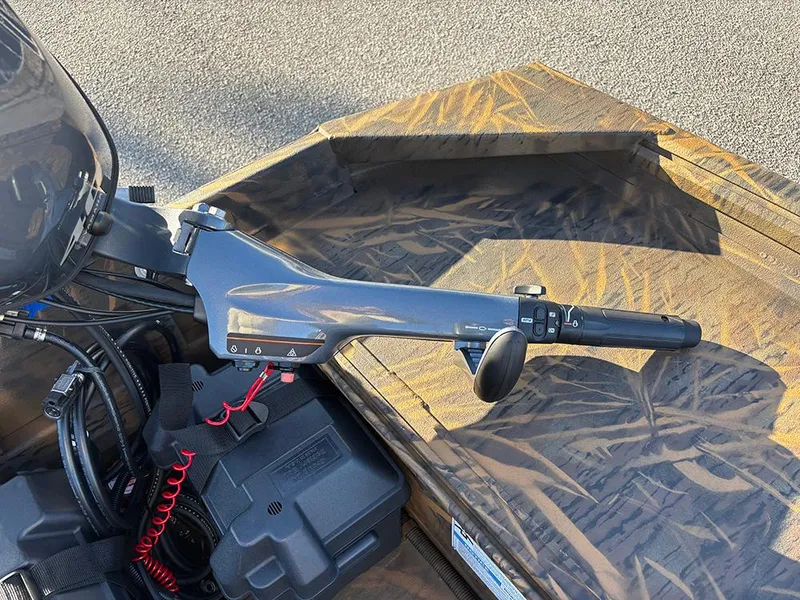 Slide: The Image of 2025 G3 Gator Tough 16 FL boat motor control with camouflage deck. - 16