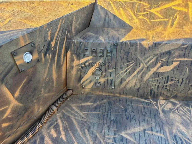 Slide: The Image of Control panel of 2025 G3 Gator Tough 16 FL boat with camouflage design. - 17