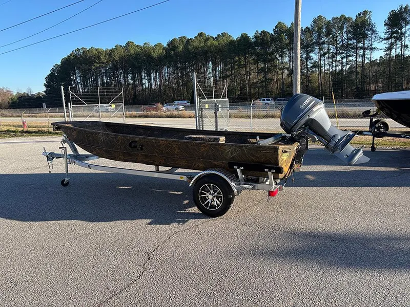 Slide: The Image of 2025 G3 Gator Tough 16 FL boat on trailer, parked outdoors. - 3