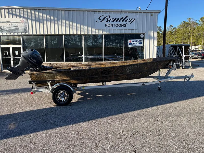 Slide: The Image of 2025 G3 Gator Tough 16 FL boat on trailer outside Bentley Pontoons dealership. - 6