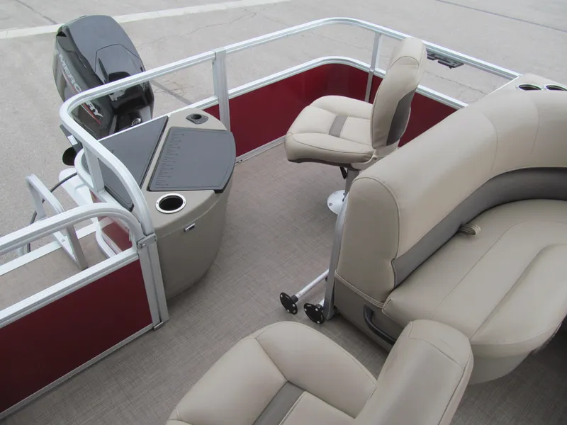 Slide: The Image of 2022 Sun Tracker Bass Buggy 18 DLX interior with beige seating and red accents. - 12
