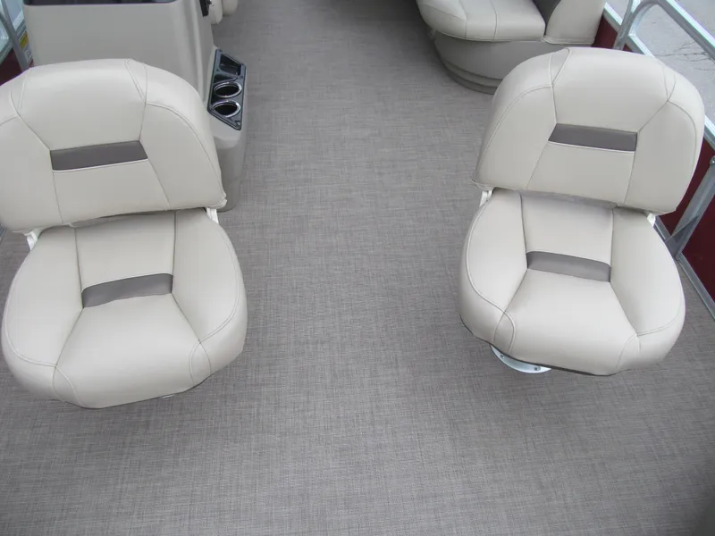 Slide: The Image of 2022 Sun Tracker Bass Buggy 18 DLX interior with beige seating and carpeted floor. - 8