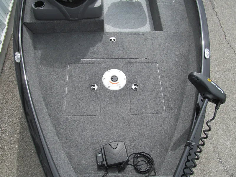 Slide: The Image of 2024 Tracker Super Guide V-16 SC boat deck with trolling motor and carpeted surface. - 11