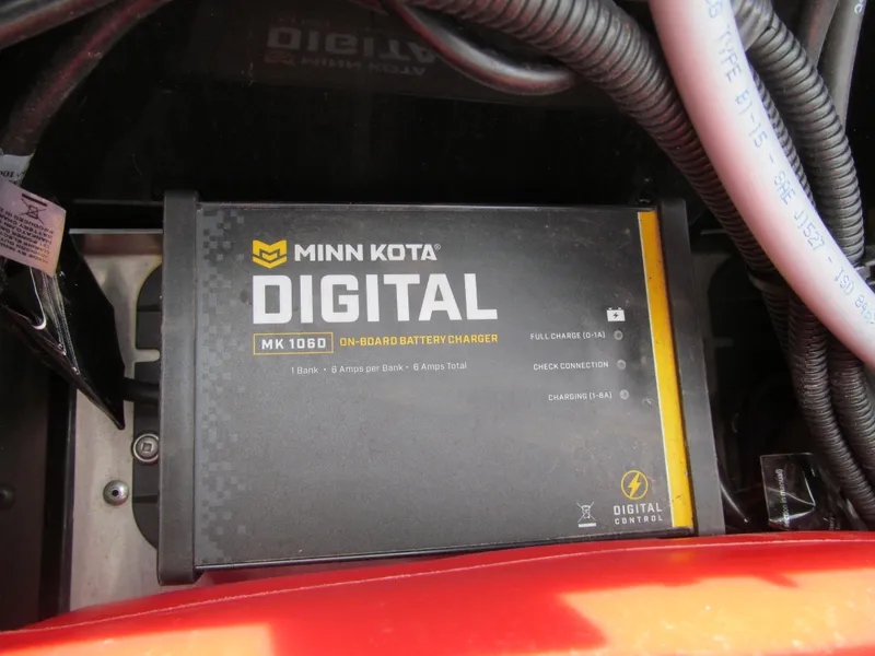 Slide: The Image of Minn Kota digital battery charger in 2024 Tracker Super Guide V-16 SC boat. - 13