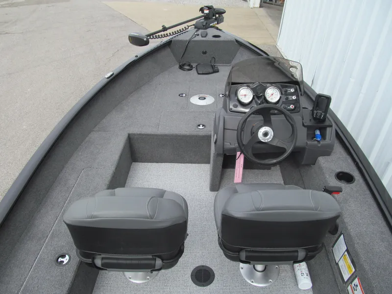 Slide: The Image of 2024 Tracker Super Guide V-16 SC boat interior with dual seats and steering console. - 5