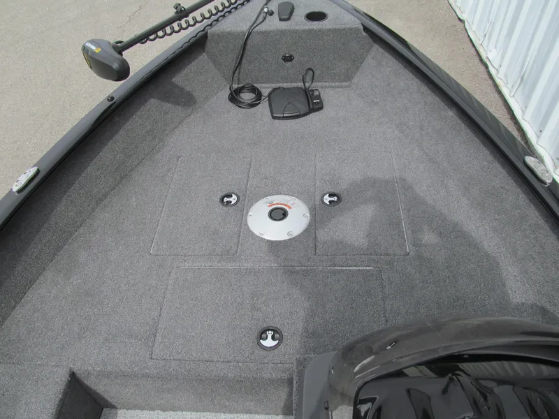 Slide: The Image of 2024 Tracker Super Guide V-16 SC boat deck with trolling motor and storage compartments. - 7