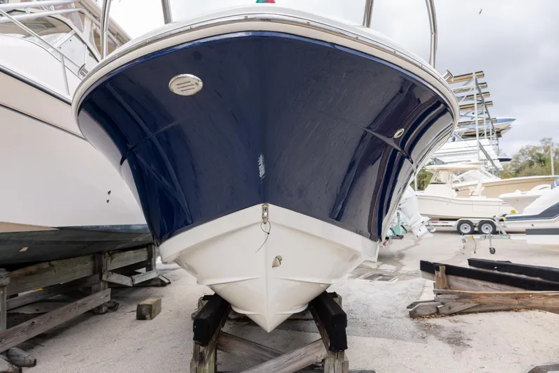 Slide: The Image of 2019 Robalo R180 Center Console boat on dry dock, front view. - 4