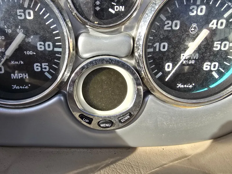 Slide: The Image of Dashboard of 2006 Larson LXI 268 BR boat with speedometer and RPM gauges. - 17