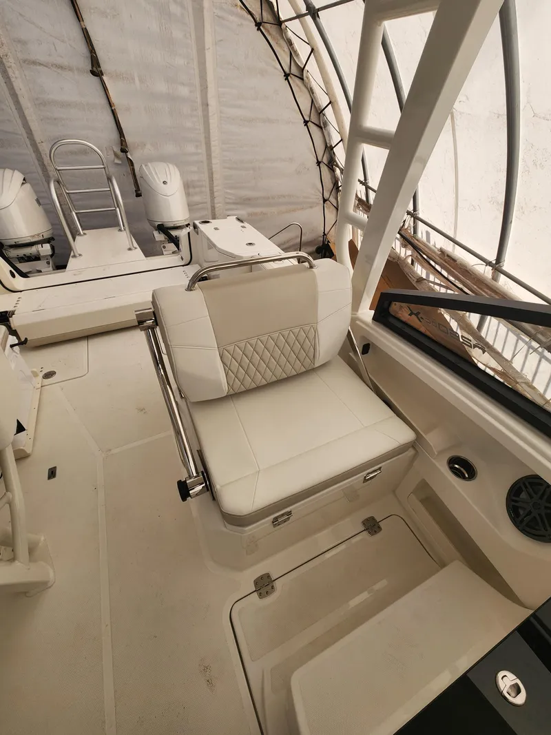 Slide: The Image of 2025 World Cat 260 DC-X boat interior with cushioned seating and modern design. - 12