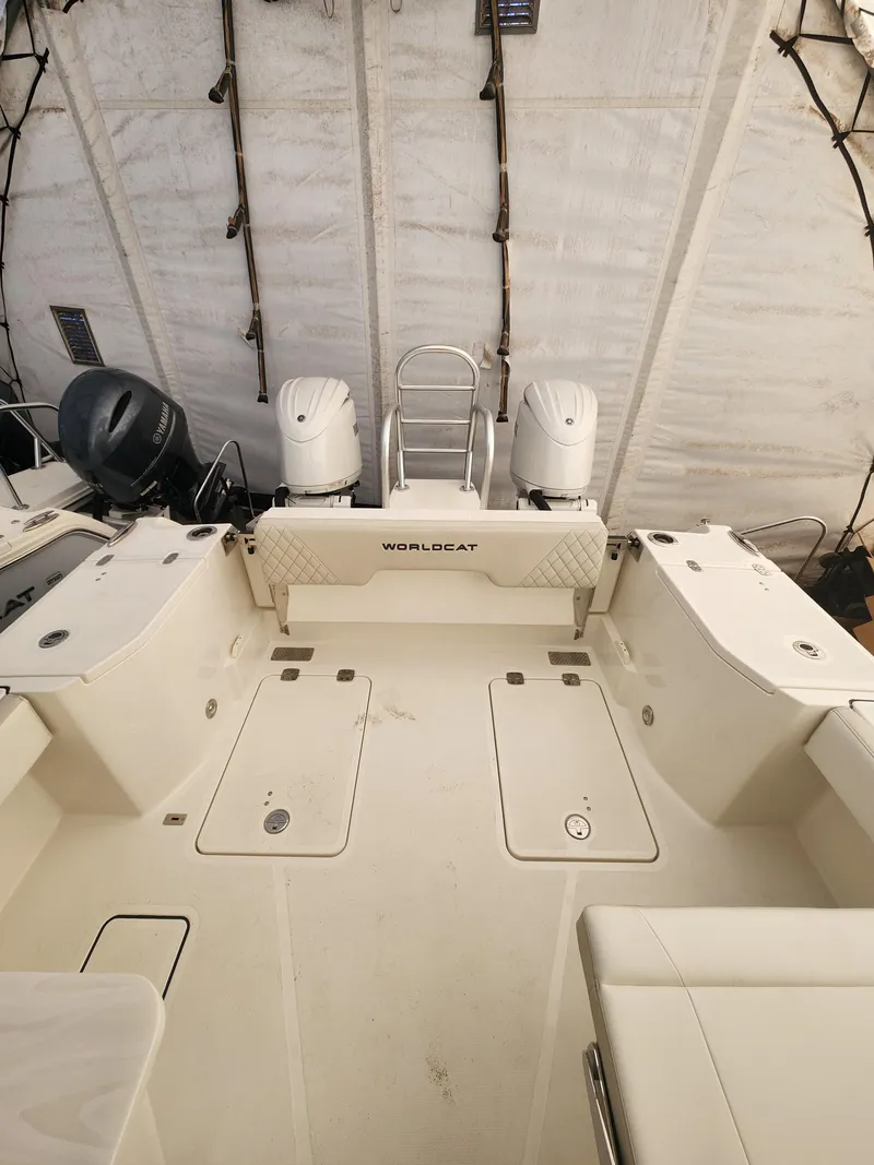 Slide: The Image of 2025 World Cat 260 DC-X boat interior with dual engines and spacious deck. - 14