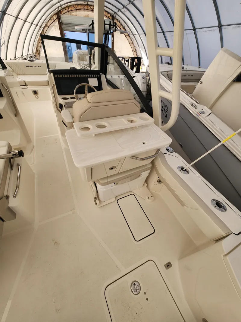 Slide: The Image of 2025 World Cat 260 DC-X boat interior with seating and storage compartments. - 4
