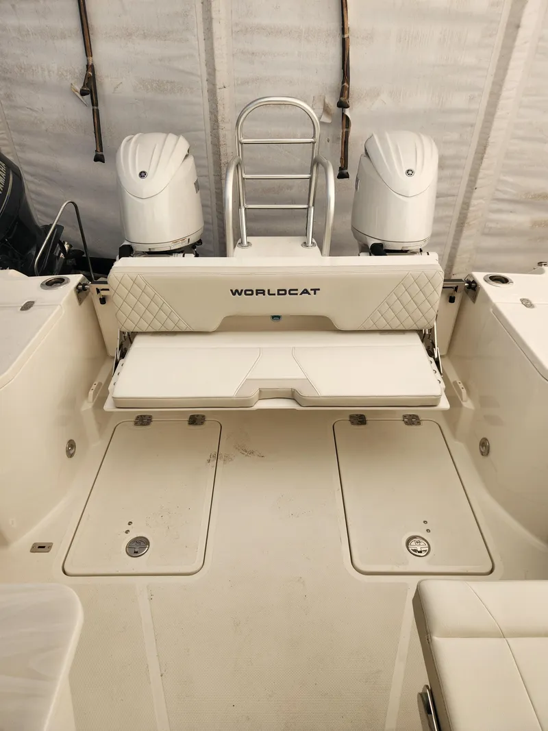 Slide: The Image of 2025 World Cat 260 DC-X boat interior with dual engines and seating. - 5