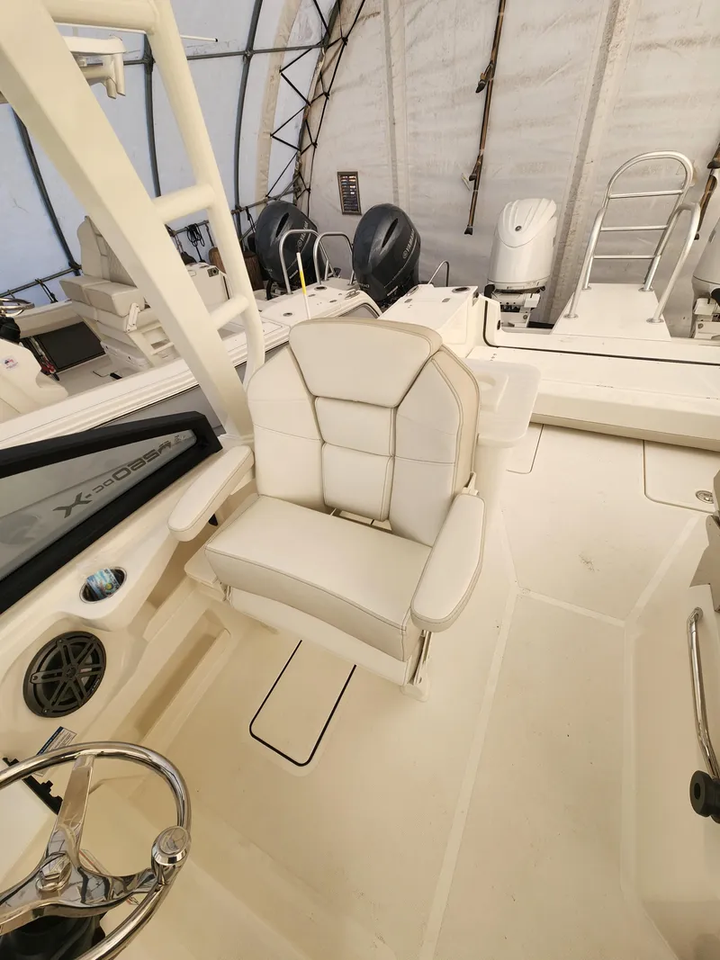 Slide: The Image of 2025 World Cat 260 DC-X boat interior with plush seating and modern controls. - 9