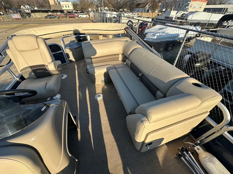 Slide: The Image of 2023 Sun Tracker Fishin' Barge 20 DLX with beige seating and spacious deck layout. - 11