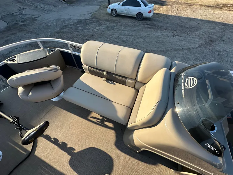 Slide: The Image of 2023 Sun Tracker Fishin' Barge 20 DLX interior with seating and console. - 13