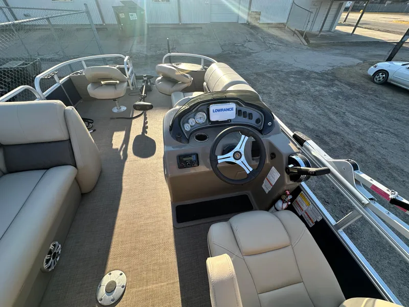Slide: The Image of 2023 Sun Tracker Fishin' Barge 20 DLX interior with steering console and seating. - 9