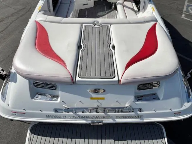 Slide: The Image of 2011 Centurion ENZO 240 boat with red and white seating, rear view. - 10