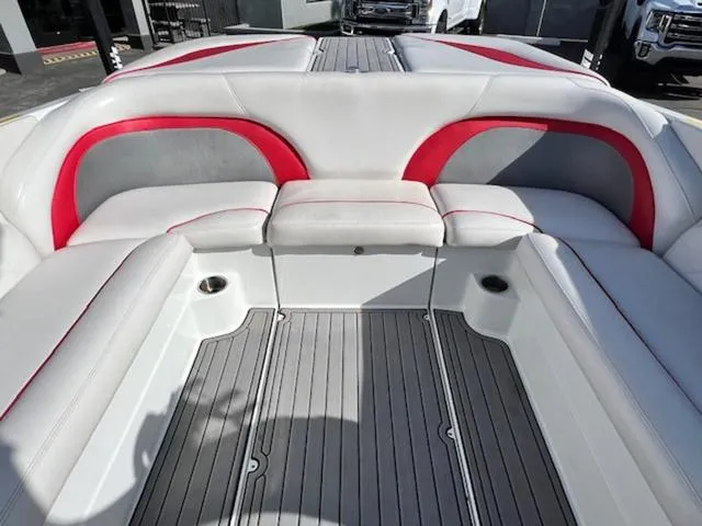 Slide: The Image of Interior of 2011 Centurion ENZO 240 boat with red and gray seating accents. - 15