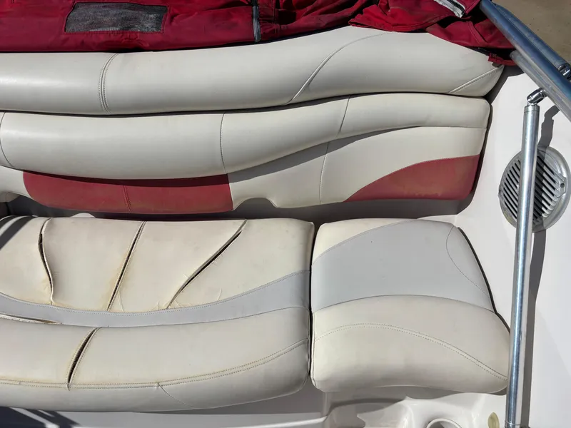 Slide: The Image of 2011 Tracker Tahoe Q5i boat seats with red and white upholstery. - 18
