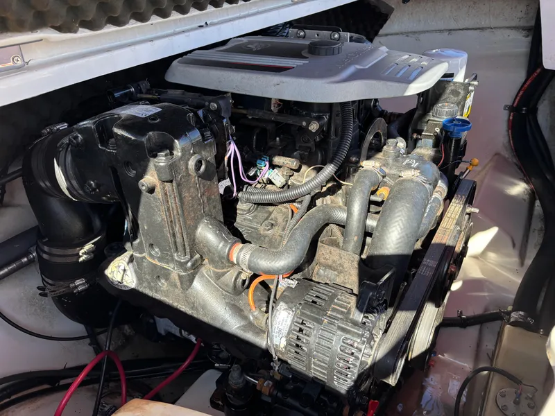 Slide: The Image of 2011 Tracker Tahoe Q5i boat engine, detailed view of components and wiring. - 27