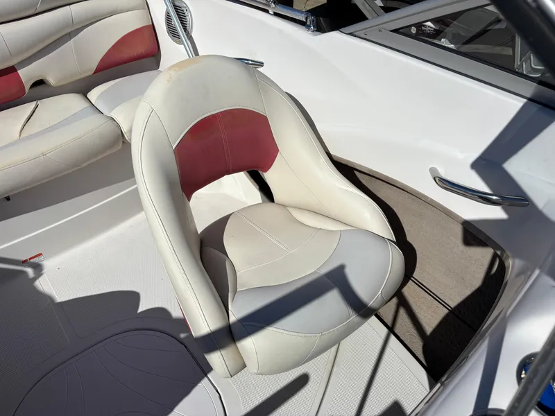 Slide: The Image of 2011 Tracker Tahoe Q5i boat interior with white and red seating. - 31