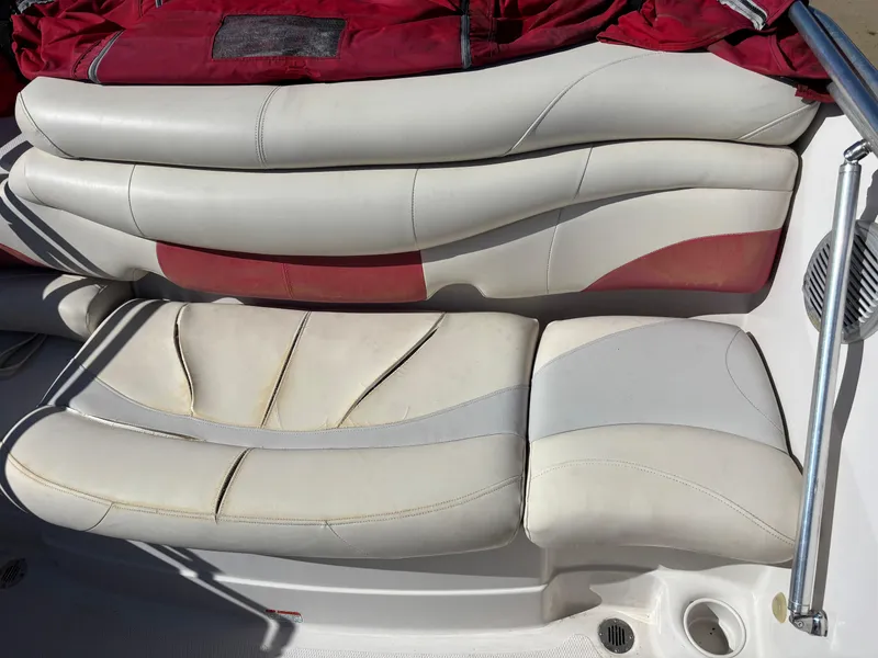 Slide: The Image of 2011 Tracker Tahoe Q5i boat interior seating with red and white upholstery. - 36