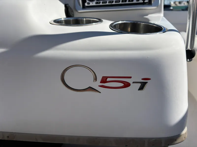 Slide: The Image of 2011 Tracker Tahoe Q5i boat logo with cup holders in sunlight. - 42